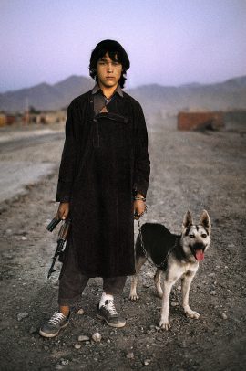 Boy with dog and gun