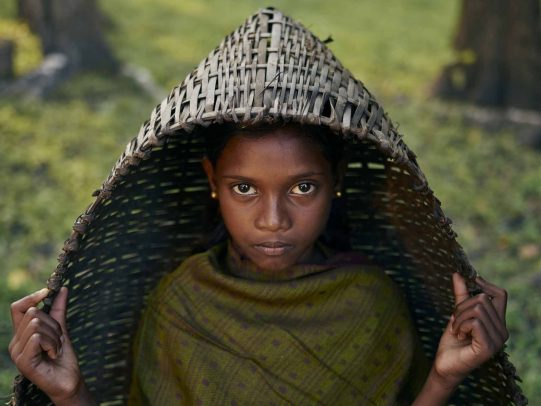 girl under a big basker