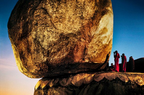 Monks praying at Golden Rock