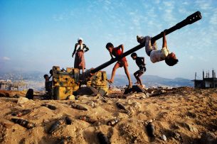 Children playing on a tank