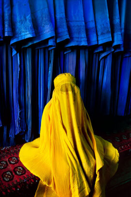 Woman in Canary Burqa on a blue background