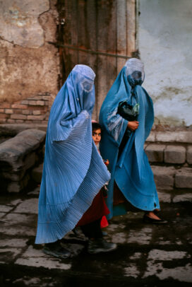 Girl Between Two Women with blue burqa in Bazaar