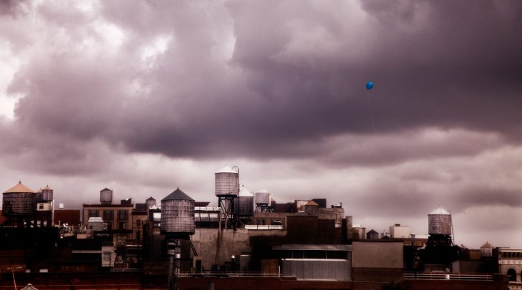 blue baloon flying over new york city