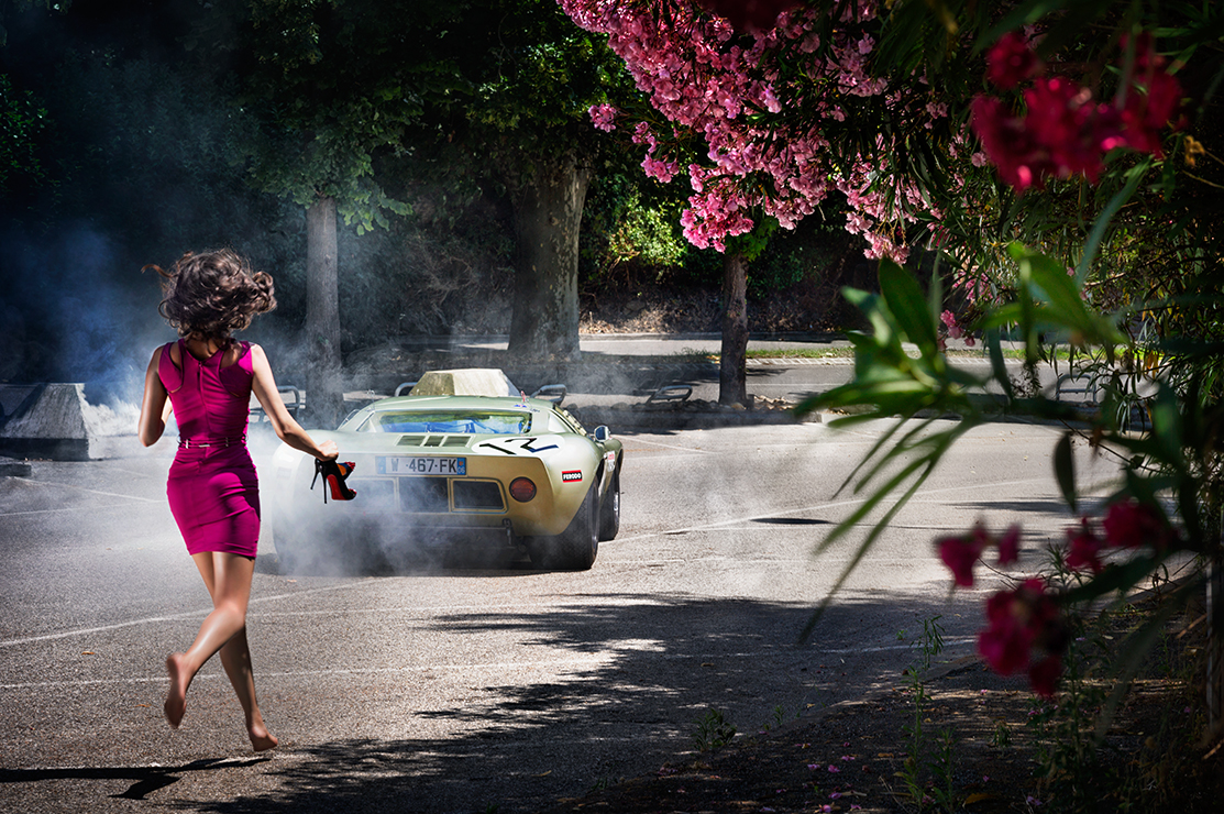 woman running bareless after a gold sport car holding her heels