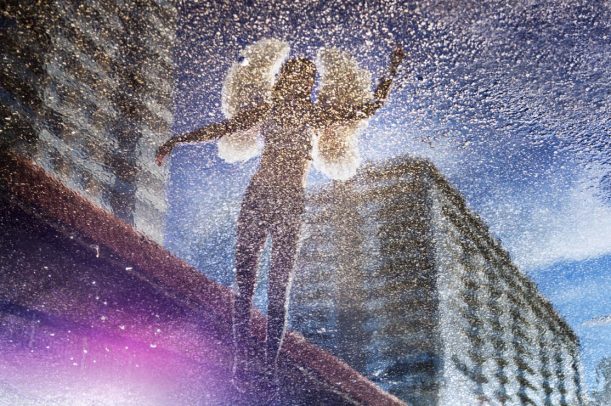 woman with angel wings flying