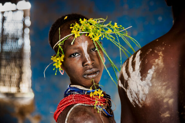 child with a crown flower