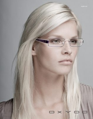 Oxydo advertising with a blonde girl wearing glasses