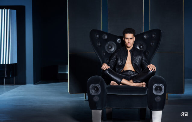 a man on an armchair with 