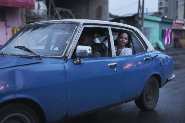 a doctor in a blue car for Novartis annual report by Joey L. 
