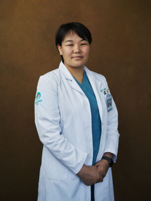 mongolian doctor posing for Novartis annual report by Joey L. 