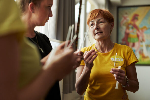 a doctor with yellow shirt and red hair during Novartis annual report by Joey L. 