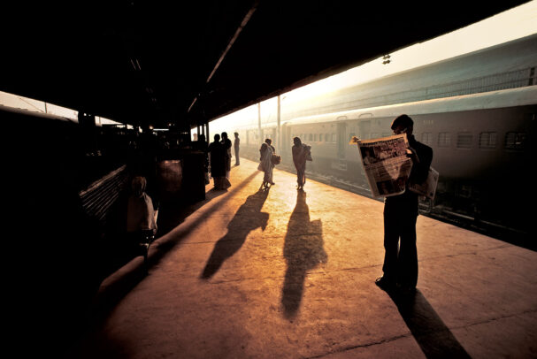 Man waiting at the train platform in Delhi