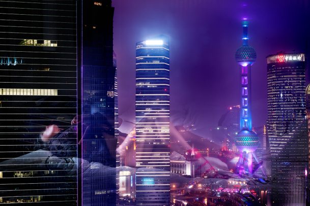 city landscape and a reflection of a woman on the bed 