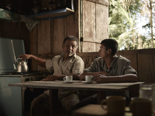 A man serving coffee to his son for Lavazza Calendar 2016 by Joey L