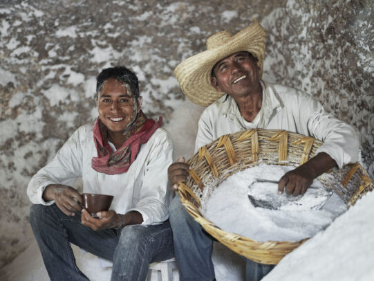a man holding a cup of coffee and the other man holding a basket full of salt for Lavazza Calendar 2016 by Joey L