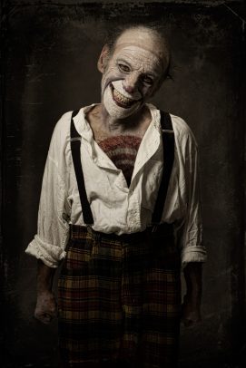 horror clown with brace smiling