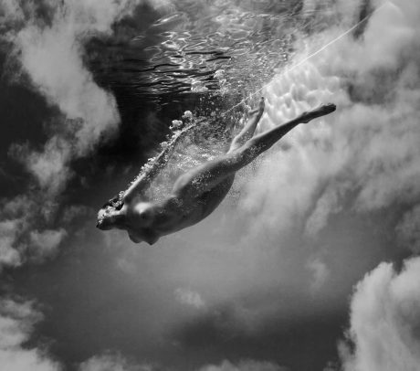 a girl swimming underwater