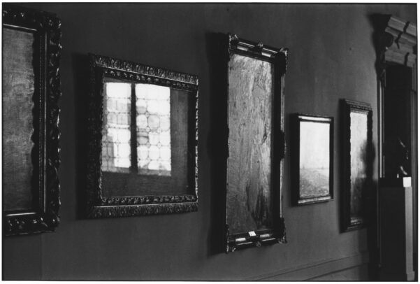 reflection of light on the glass of paintings