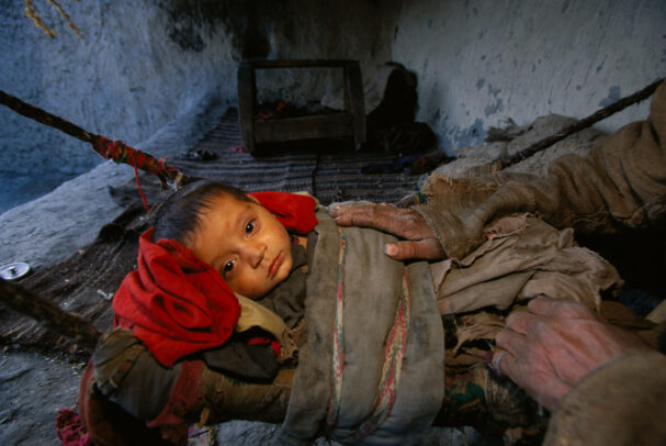 A child sleeps in a hammock