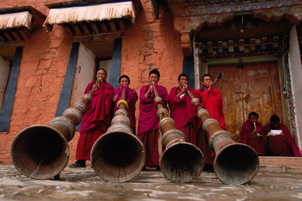 monks using the traditional 13-foot horns