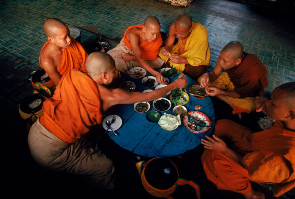 Young monks share a communal breakfast 