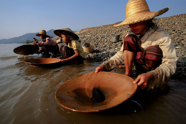 girls prospecting for gold along the banks of the Mekong