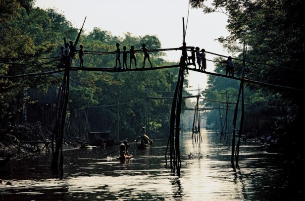 children on a monkey bridge in Vietnam