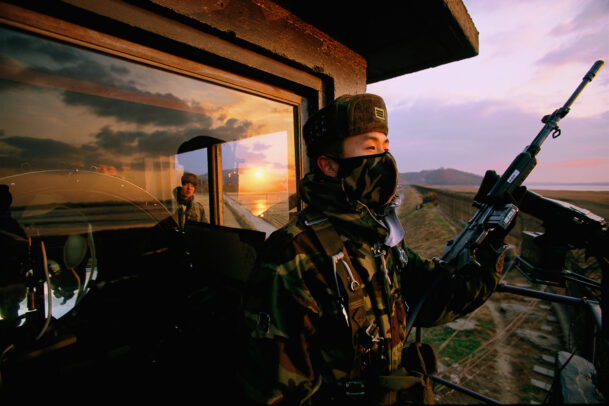 South Korean soldier scanning for infiltrators from North Korea