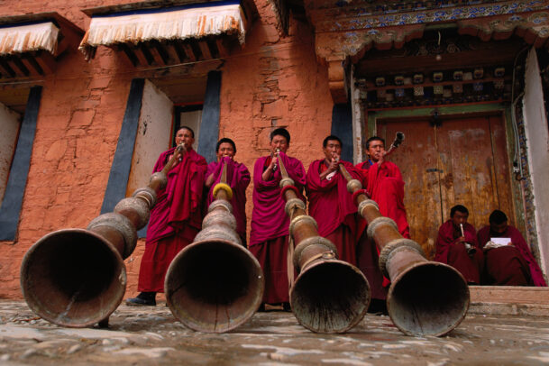 Music lesson for Labrang's monks using the traditional 13-foot horns.