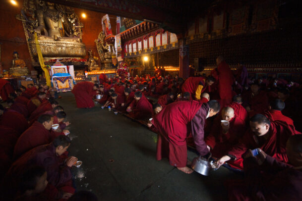 At Shechen monastery in Sichuan Province, monks mix tea into tsampa, roasted barley flour, to make a meal