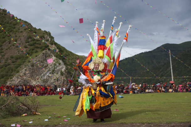 an actor portrays the legendary Tibetan warrior King Gesar at a festival at Shechen monastery