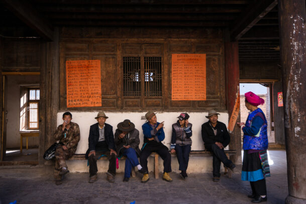 men sitting on a bench