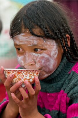 girl drinking from a cup